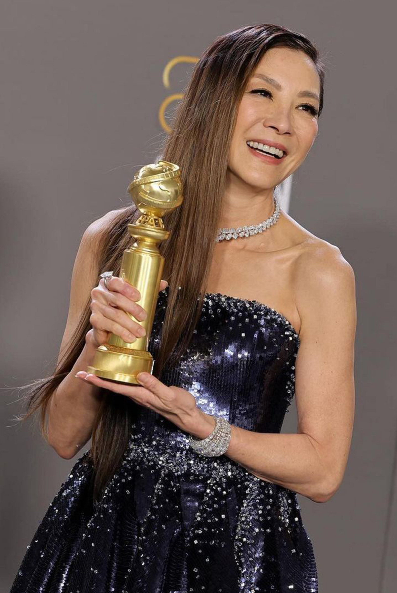 Michelle Yeoh with her Golden Globes award
